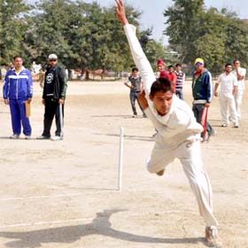 A participant in action during the cricket trials held at Police Public School in Bathinda on Saturday