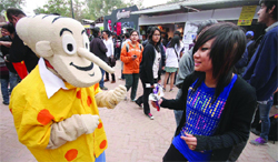 Visitors enjoy a character from the Amar Chitra Katha at an exhibition in Delhi Haat in New Delhi 