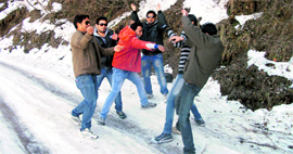 Tourists enjoy snow at Buraskhanda.