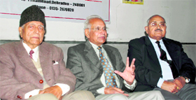 Prem Chand Aggarwal (centre), Chairman, Cheshire Home India, addresses a press conference in Dehradun on Saturday.