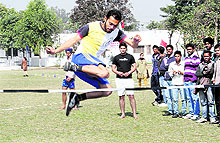 An athlete participates in the high jump at the Guru Nanak National College in Doraha on Saturday