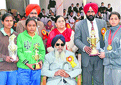 Olympian Pargat Singh poses with winning students at Jagraon on Saturday