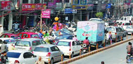 Vehicles move at a snails pace on the road.