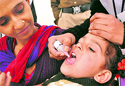 A child is immunised at the Sector-43 ISBT in Chandigarh on Sunday