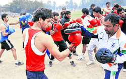 Boxing coach Om Prakash trains PU boxers in a camp for the upcoming inter-university championship
