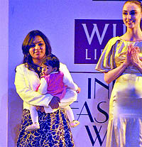 One-year-old Aalia as showstopper with her fashion designer mother Tahera Peeran walking on ramp during the last day of Wills Lifestyle India Fashion Week in New Delhi on Sunday.