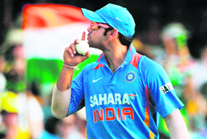 Virat Kohli gestures to spectators after taking a catch to dismiss Peter Forrest in Brisbane on Sunday.