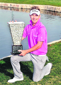 Jbe Kruger of South Africa poses with the winner's trophy after the final round of the Avantha Masters in Gurgaon