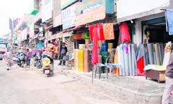 As footpaths have been encroached upon by shopkeepers, pedestrians have difficulty in finding their way at Ram Bagh Chowk in Amritsar. 