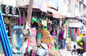 Shopkeepers display their wares onto the footpaths at Ram Bagh Chowk in Amritsar.