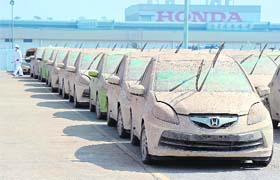 In this file photo, damaged cars are seen at the Honda factory in Ayutthaya province