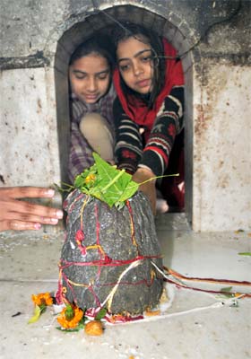 Devotees pay obeisance at the temple