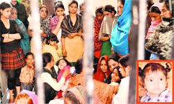 Wailing relatives and neighbours of Ghena (inset), who was killed in an accident at Sector 38-A, Chandigarh,