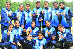 The winning soft ball team of Panjab University with the championship trophy in Chandigarh