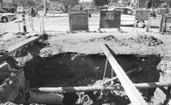 It has been over a month that this caved-in portion of a sewer line at the Kumbra Traffic junction on the Chandigarh-Sohana road is without repairs