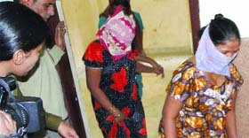 The police rescues women from G.B.Road in New Delhi on Monday.