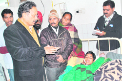 Chief Minister BC Khanduri enquires about the health of one of the victims of an explosion at Maharana Pratap Sports College at Doon Hospital in Dehradun