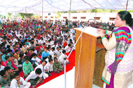 Education Minister Geeta Bhukkal addresses students of Government Senior Secondary School at Sehlanga village in Jhajjar. 