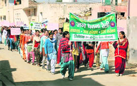 Students of the Government Postgraduate College for Women participate in an awareness rally on water conservation  at Bhodia Khera in Fatehabad. 