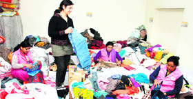Members of NGO Goonj give new shape to old and used clothes at its processing centre in Jalandhar.