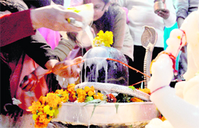 Devotees offer milk on a Shivling on the occasion of Mahashivratri at Nav Durga Mandir in Sarabha Nagar, Ludhiana, on Monday.