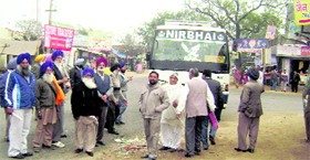 Activists of social organisations stage a protest at Mandi Ahmedgarh.