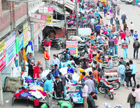Not caring two hoots for norms, shopkeepers encroach upon footpaths and a part of the railway link road in Amritsar.