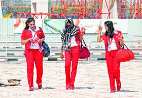 Kingfisher Airlines stewardesses leave Bangalore airport on Tuesday