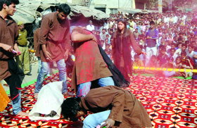 Students of Rajdhani College present a nukkad natak against drug de-addiction during an awareness programme by the Delhi police at Moti Nagar in New Delhi on Tuesday.