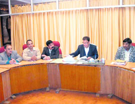 Mussoorie Municipal Council president OP Uniyal discusses issues related to the town at a meeting in Mussoorie on Tuesday.