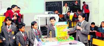Students participate in a quiz at The Doon Girls School in Dehradun on Tuesday. 
