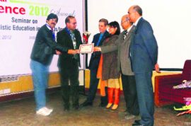 Directors of Vidyapeeth Dr Ramesh Sharma and Ravinder Avasthi receive the Educational Excellence Award-2012 at IIT-Delhi