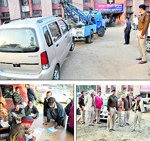 A wrongly parked vehicle being towed away at Ghumar Mandi in Ludhiana on Tuesday