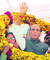 BJP leader Rajnath Singh greets the gathering in Auraiya on Tuesday.