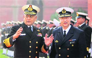 Chief of Staff of German Navy Vice Admiral Axel Schimpf (R) with Chief of Naval Staff Admiral Nirmal Verma after inspecting a guard of honour at South Block in New Delhi on Tuesday