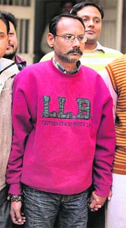 Alleged Pakistani spy Kamran Akbar being taken to a court in New Delhi on Tuesday. 