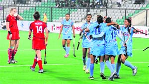 Indian womens hockey team celebrate after scoring a goal against Poland at the National Stadium in New Delhi on Tuesday.  India beat Poland 3-1. 