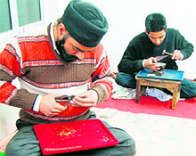 Artisans design jewellery at a workshop in Amritsar