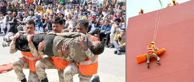 Members of the NDRF demonstrate techniques to evacuate people in case of any calamity, during a mock drill organised at the Mini-secretariat in Bathinda on Wednesday. 