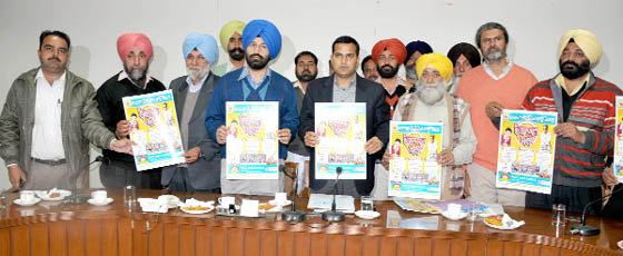 Members of the organising committee along with Bathinda DC and SSP release the poster of the Virasat Mela, in Bathinda on Wednesday. 