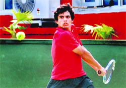 Sanam returns a shot in a singles match of the ITF Mens Future $ 10,000 Tennis Tournament in Chandigarh on Wednesday.