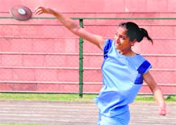 A player in action during the Inter-School Atheltics meet at the Sports Complex in Chandigarh.