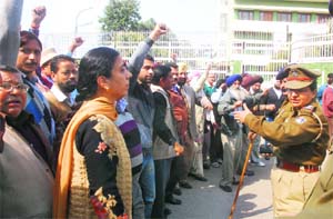 The Joint Action Committee of Aided College Teachers and Non-teaching Employees Union of Chandigarh protests at DAV College, Sector 10, Chandigarh, on Wednesday. 