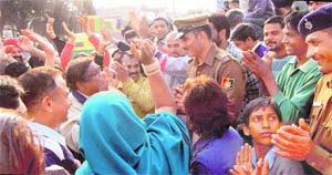 Residents argue with a police official at Dadu Majra in Chandigarh on Wednesday. 