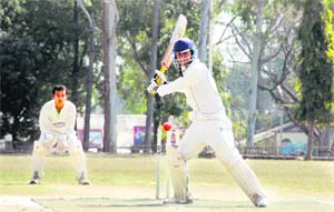 A batsman plays a shot in a match in the 60th Dehradun District Cricket League in Dehradun on Wednesday. 
