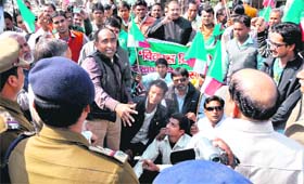 Uttarakhand Kranti Dal activists participate in a protest march at Matri Sadan in Haridwar on Wednesday. T