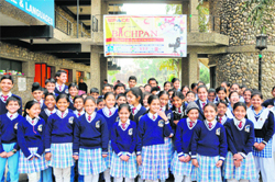 Students gather outside the Abhinav theatre to watch a movie during the first North Zone children film festival in Jammu