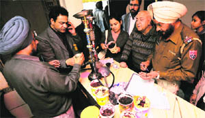 Health officials at Mr Beans Hukkah Bar, Ludhiana, on Wednesday. 