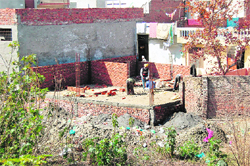Construction activities continue unabated on a land belonging to the Institute of Mental Health in Amritsar. 