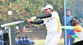 A player of Pune University hits the ball during the All-India Soft Ball Inter-university tournament at Panjab University, Chandigrh, on Thursday.